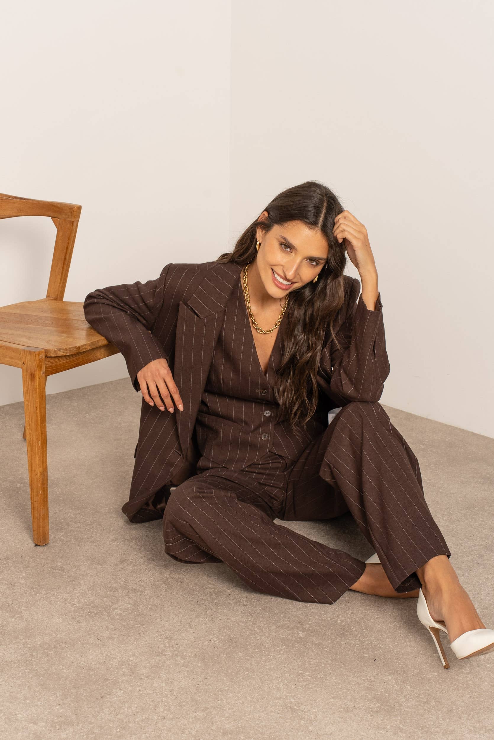 Mouwloos gestreept gilet.